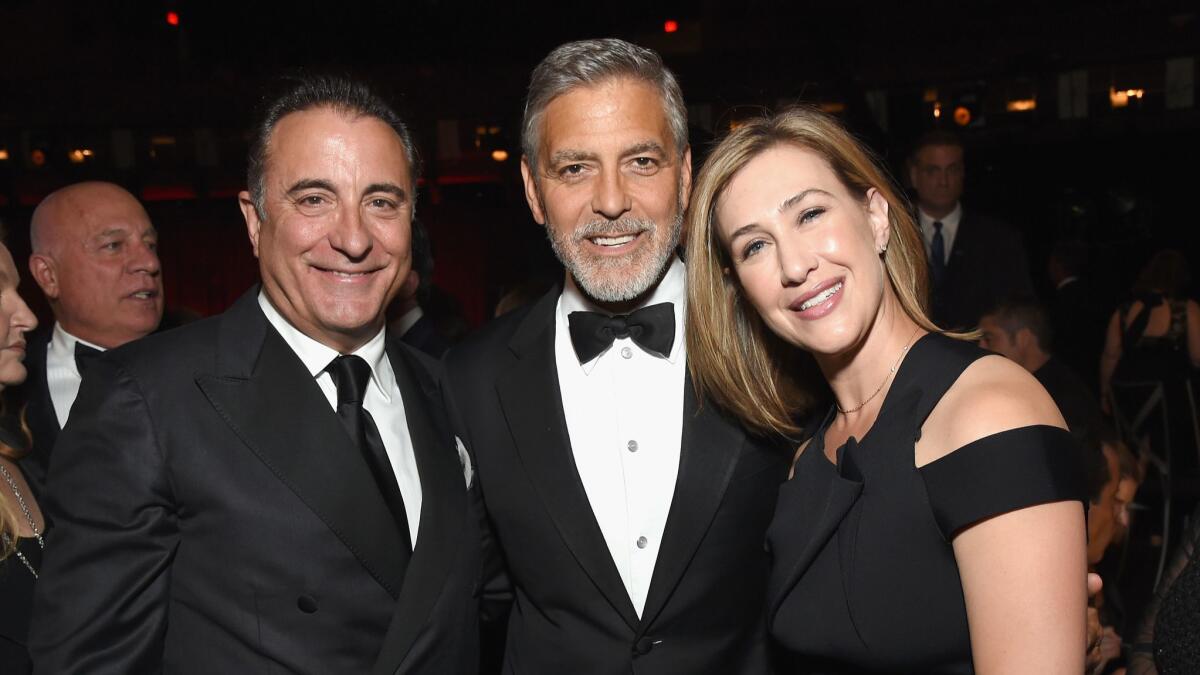 Andy Garcia, left, George Clooney and Paramount Television President Amy Powell attend the American Film Institute's 46th Life Achievement Award Gala Tribute to Clooney at Dolby Theatre on June 7 in Hollywood.