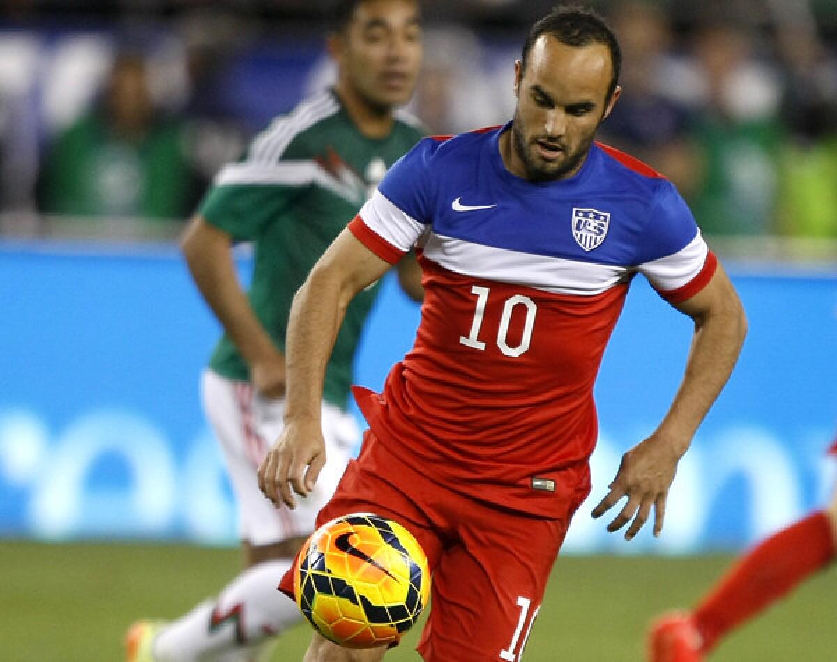 U.S. midfielder Landon Donovan runs onto the ball against Mexico during the second half of a friendly.