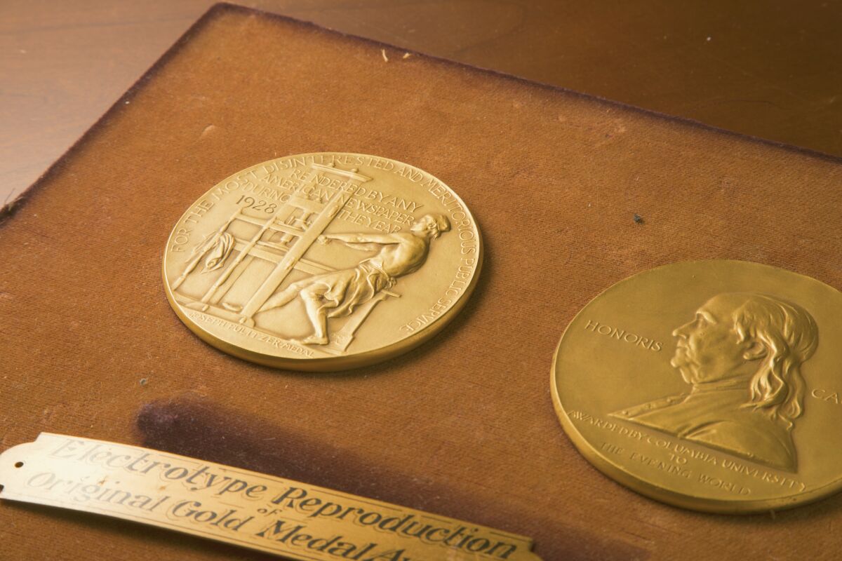This undated photo shows the front and back sides of the medal awarded for the Pulitzer Prizes in New York. The Pulitzer Prizes are set Monday, May 9, 2022 to honor the best journalism from a tumultuous year that saw an insurrection, the frantic end of the United States' longest war and fallout from the ongoing coronavirus pandemic and catastrophic climate change. (The Pulitzer Prizes via AP)