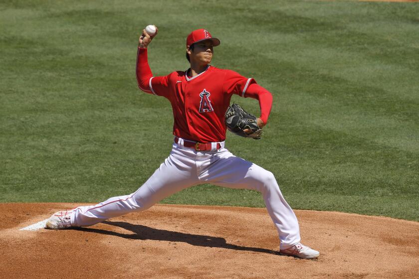 Los Angeles Angels pitcher Shohei Ohtani throws to the plate during an intrasquad game in the restart of baseball training camp Monday, July 13, 2020, in Anaheim, Calif. (AP Photo/Mark J. Terrill)