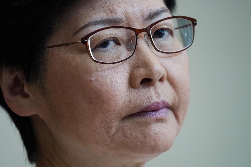 Hong Kong Chief Executive Carrie Lam, listens to reporters questions during a press conference at the government building in Hong Kong Tuesday, Sept. 10, 2019. Hong Kong leader Lam renews an appeal to pro-democracy protesters to halt violence and engage in dialogue, as the city's richest man urged the government to provide a way out for the mostly young demonstrators. (AP Photo/Vincent Yu)