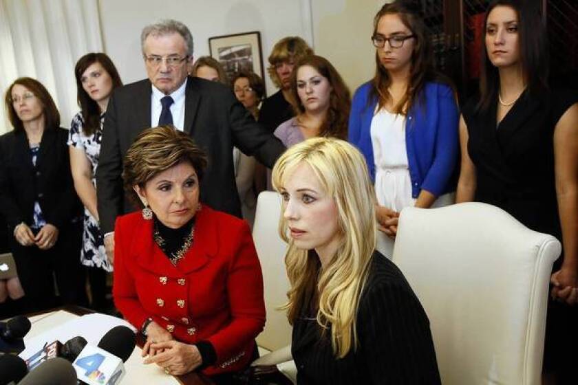 Attorney Gloria Allred, left, and Caroline Heldman, professor of politics, along with sexual assault victims at a news conference last April to announce the filing of a complaint against Occidental.