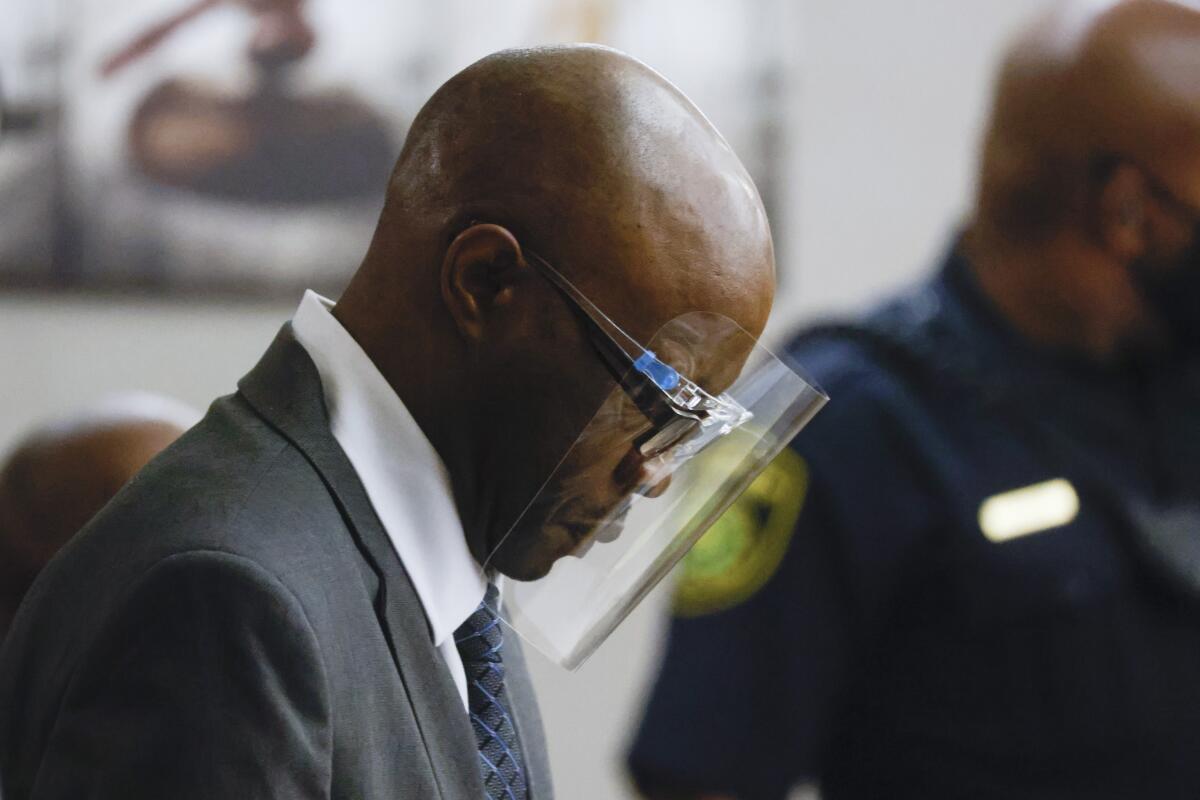 Defendant Billy Chemirmir enters the courtroom during the final day of his third court trial at Frank Crowley Courts Building in Dallas on Friday, Oct. 7, 2022. Chemirmir, 49, is charged with capital murder of 22 elderly people in North Texas. (Shafkat Anowar/The Dallas Morning News via AP)