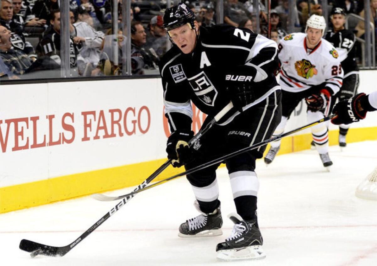 Kings' Matt Greene clears the puck during a game against the Chicago Blackhawks.