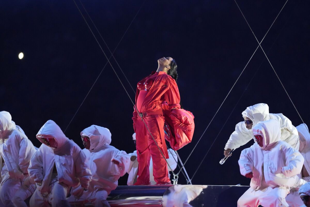 Singer Rihanna and background dancers onstage during the Super Bowl