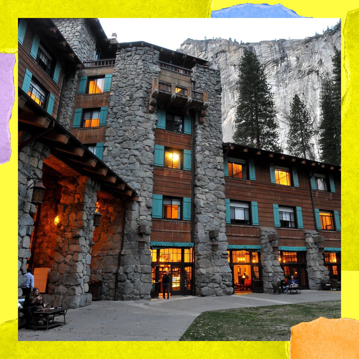 A towering hotel with a rounded-stone facade, with mountains and evergreens towering even higher in the background.