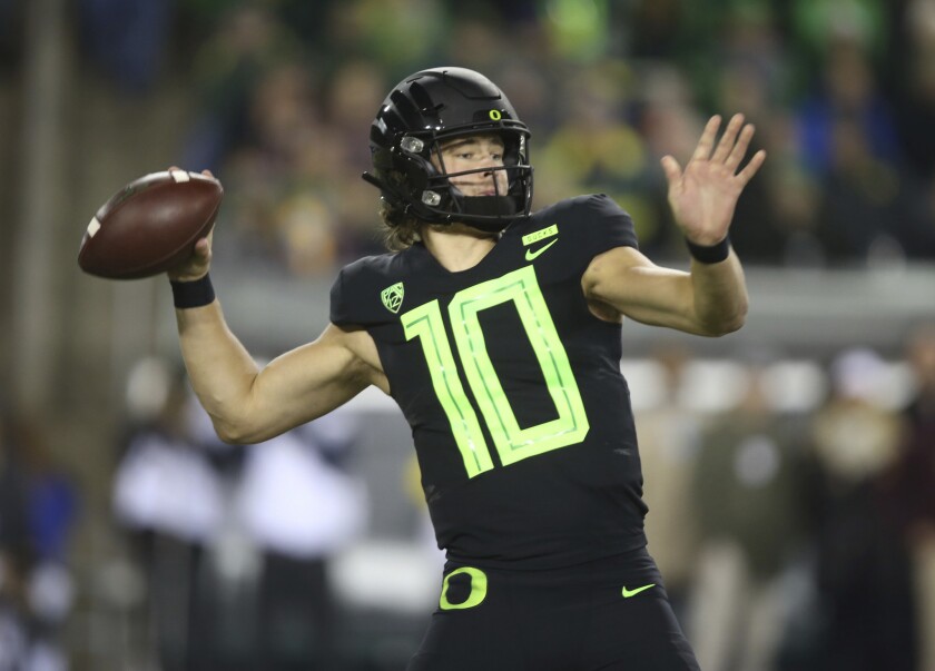  Oregon quarterback Justin Herbert, who many believe could end up with the Chargers, prepares to unleash a pass.