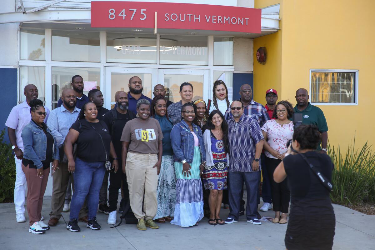 A group of people outside an office