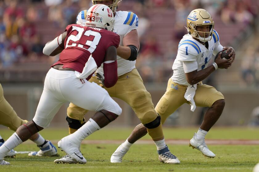 UCLA quarterback Dorian Thompson-Robinson (1) scrabbles against the Stanford during the first half of an NCAA college football game Saturday, Sept. 25, 2021, in Stanford, Calif. (AP Photo/Tony Avelar)