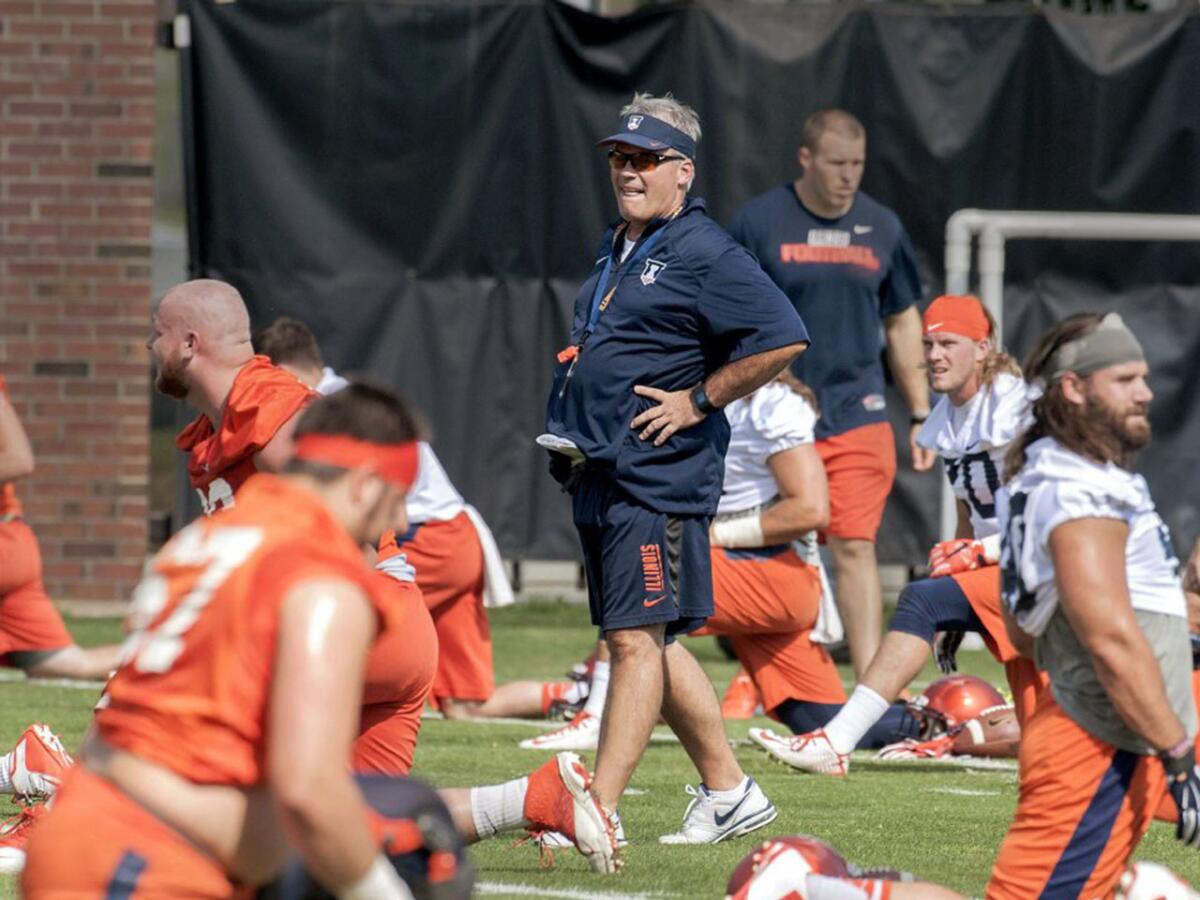 Illinois Coach Tim Beckman watches his team during a practice in Champaign, Ill. on Aug. 6.
