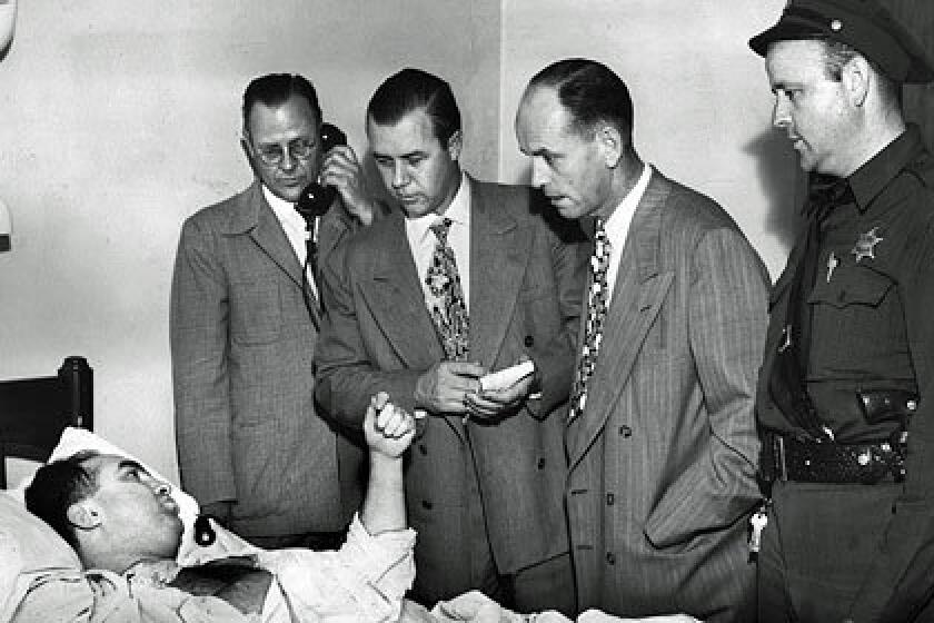 L.A. mobster Mickey Cohen tells officers in July 1949 of the shooting outside Sherrys cafe on Sunset Boulevard that left him with a wound to the shoulder and columnist Florabel Muir with a gunshot to her hindquarter.