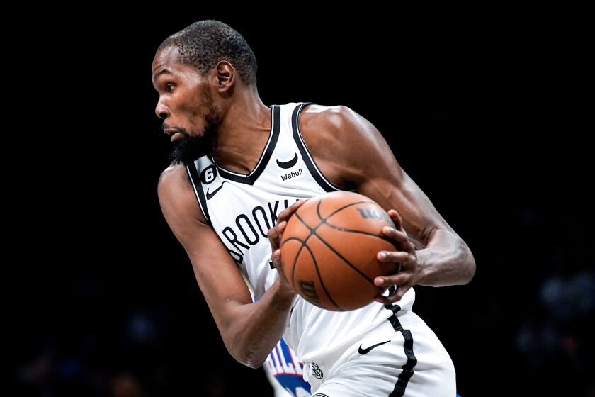 Brooklyn Nets forward Kevin Durant handles the ball during the first half of a preseason NBA basketball game against the Philadelphia 76ers, Monday, Oct. 3, 2022, in New York. (AP Photo/Julia Nikhinson)