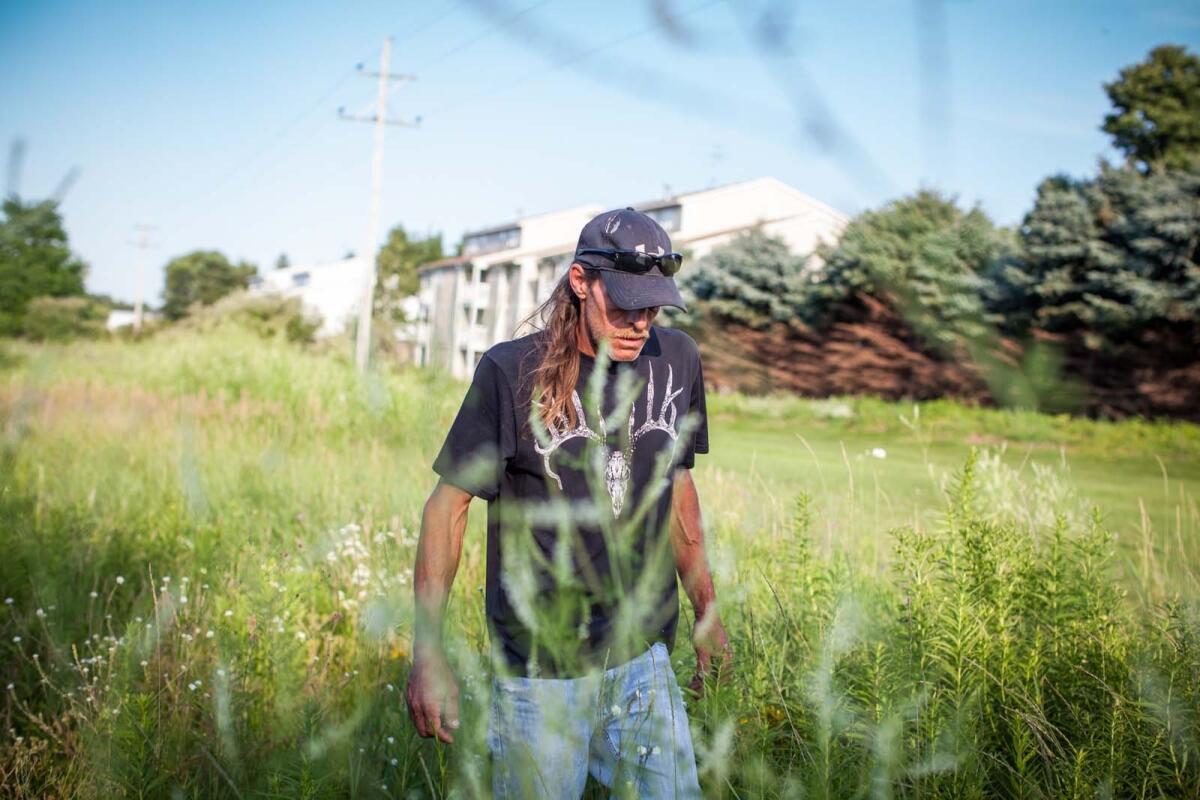 Greg Slocumb, father of missing woman Brooke Slocumb, searches Gezon Park in Wyoming, Mich. Police found Slocumb's boyfriend, Charles Gerard Oppenneer, dead near Gezon Park on Wednesday.