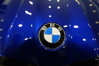 FILE - The company logo shines on the hood of an unsold vehicle at a Mini Honda BMW dealership on July 22, 2024, in Highlands Ranch, Colo. (AP Photo/David Zalubowski, File)