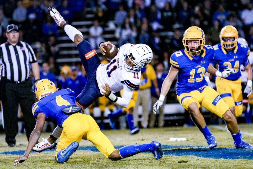 The Bishop Amat player upending Chaminade QB Seth Shigg is defensive back Foster Slaughter.