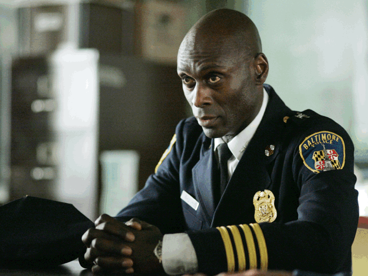 A slideshow includes images of actor Lance Reddick in "The Wire," "Fringe," and John Wick: Chapter 3 — Parabellum"