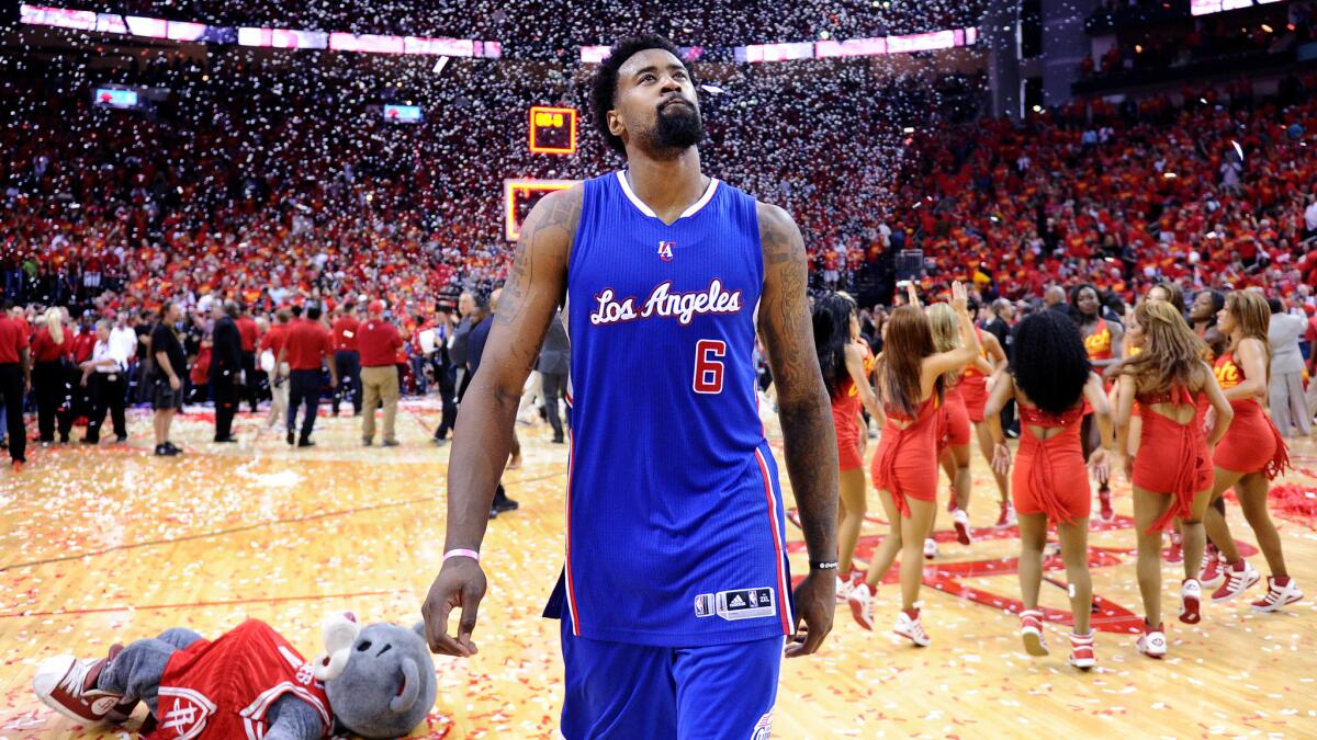 Clippers center DeAndre Jordan walks off the court following the team's 113-100 loss to the Houston Rockets in Game 7 of the Western Conference semifinals on Sunday.