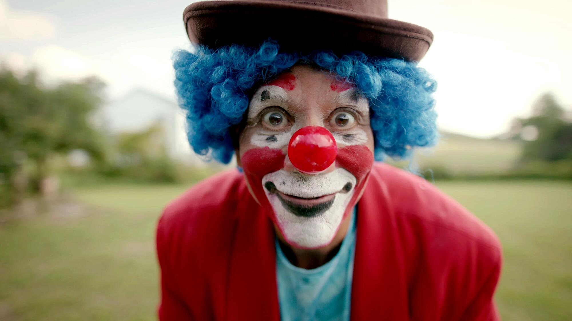 A close-up of a man dressed as a clown.