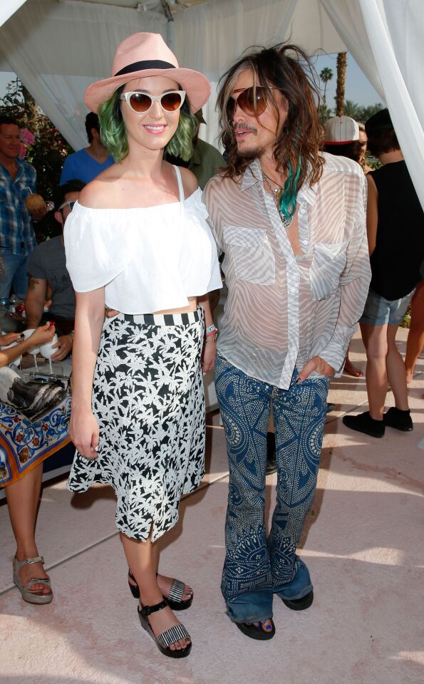 Singers Katy Perry and Steven Tyler attend the Lacoste beautiful desert pool party.
