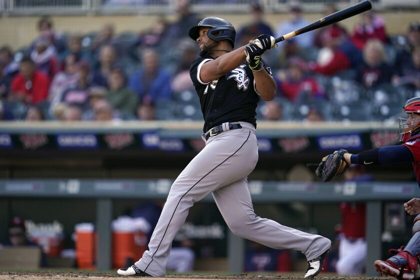 FILE - Chicago White Sox's Jose Abreu hits an RBI-double during the eighth inning of a baseball game against the Minnesota Twins, on Thursday, Sept. 29, 2022, in Minneapolis. Abreu and the World Series champion Astros agreed to a three-year contract Monday, Nov. 28 adding another powerful bat to Houston's lineup. (AP Photo/Abbie Parr, File)