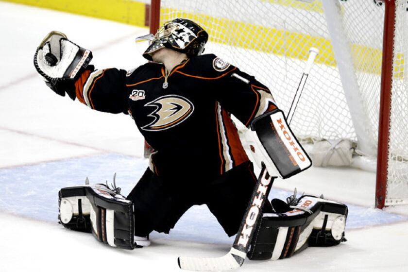 Ducks goalie Jonas Hiller makes a save against the Sharks during the second period of a game last week at the Honda Center in Anaheim.