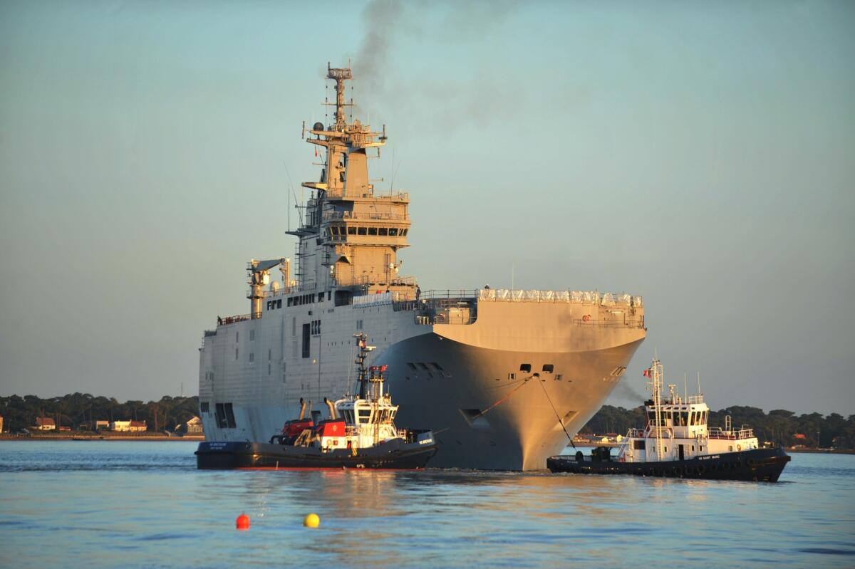 In A March 5 photo, the Vladivostok, a French-built Mistral class amphibious vessel ordered by Russia, leaving on her first trial run from a shipyard in Saint-Nazaire, France.