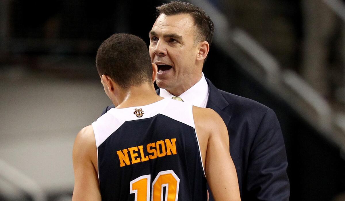 UC Irvine Coach Russell Turner talks to guard Luke Nelson during their 57-55 loss to Louisville on Friday in Seattle.