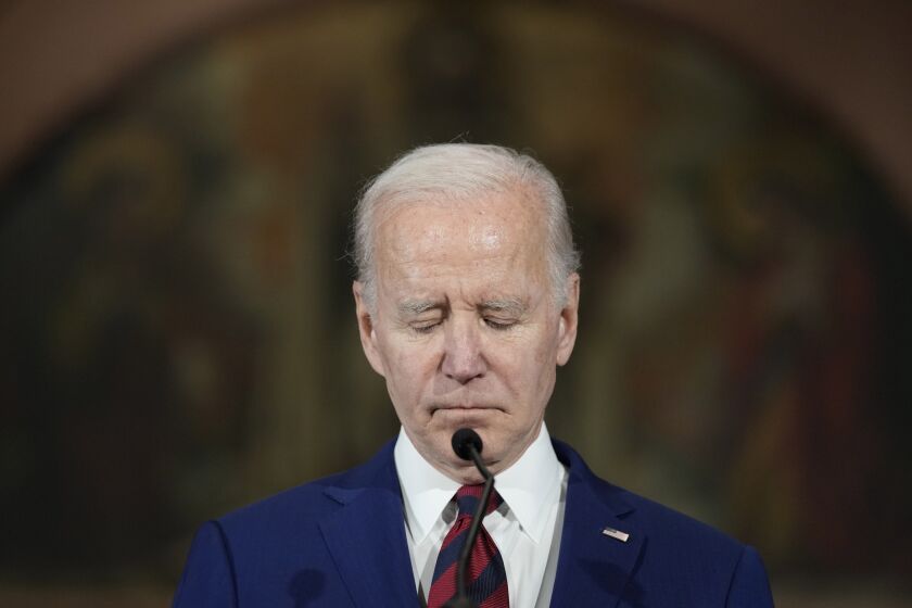 President Joe Biden pauses for a moment of silence as he speaks during an event in Washington, Wednesday, Dec. 7, 2022, with survivors and families impacted by gun violence for the 10th Annual National Vigil for All Victims of Gun Violence. (AP Photo/Susan Walsh)