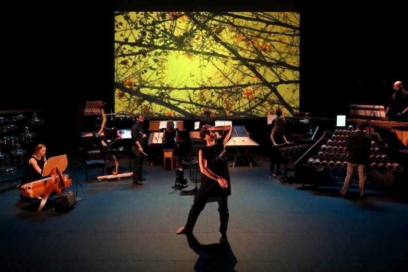 LOS ANGELES, CALIF. -- FRIDAY, JUNE 15, 2018: Joel Smith, of casebolt and smith troop, during a dress rehearsal of âDaphne of the Dunes,â by Harry Partch, Americaâs original maverick composer, played on the instruments he invented, at the REDCAT in Los Angeles, Calif., on June 15, 2018. (Gary Coronado / Los Angeles Times)