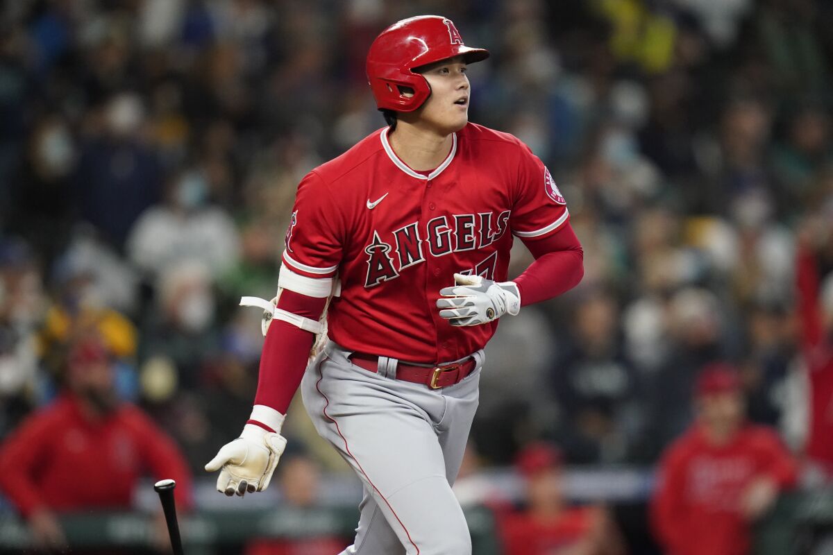 Angels' Shohei Ohtani watches the path of his solo home run against the Seattle Mariners.