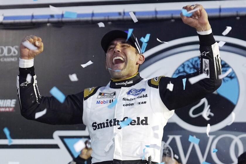 Aric Almirola celebrates after winning the NASCAR Cup Series auto race Sunday, July 18, 2021, in Loudon, N.H. (AP Photo/Charles Krupa)