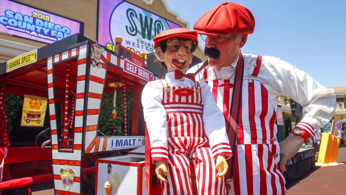 Jerry Hager, who is Pops, and his puppet Lolly provide entertainment during a press conference by the San Diego County Fair at the Del Mar fairgrounds in Del Mar on Wednesday.