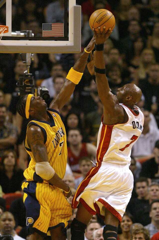 Heat forward Lamar Odom uses his length and leaping ability to attack the basket against Pacers center Jermaine O'Neal in Game 6 of the Eastern Conference semifinals. Odom had his best statistical season as a pro that season, averaging 17.1 points, 9.7 rebounds, 4.1 assists, 1.1 steals and nearly 1 block a game.