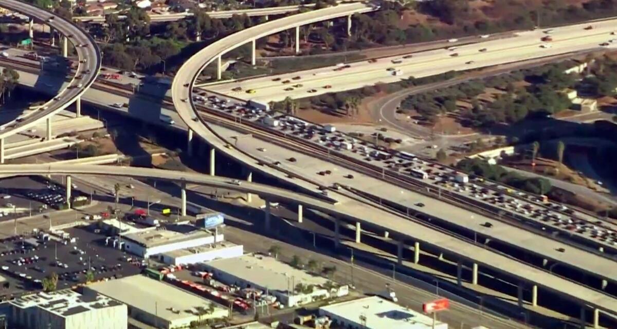 Aerial view of traffic filling all lanes of one side of a freeway