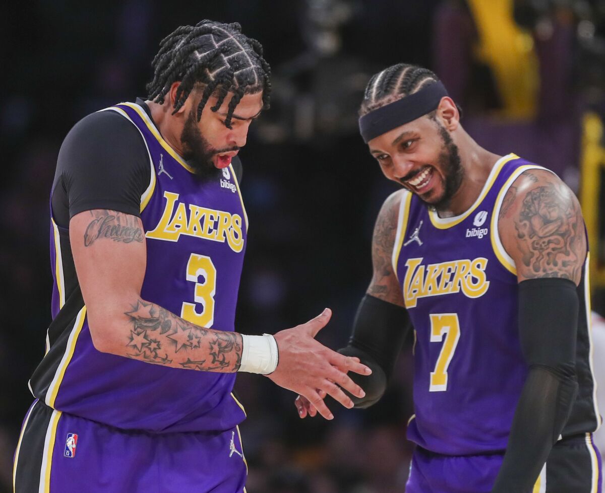 Lakers forward Carmelo Anthony, right, congratulates teammate, center Anthony Davis