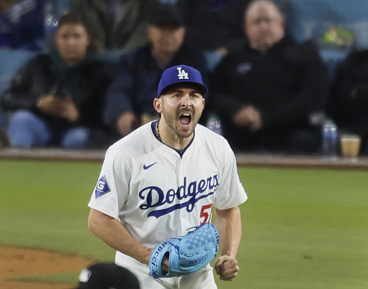 Dodgers pitcher Alex Vesia shouts as the Giants' Austin Slater flies out to in the sixth inning at Dodger Stadium 