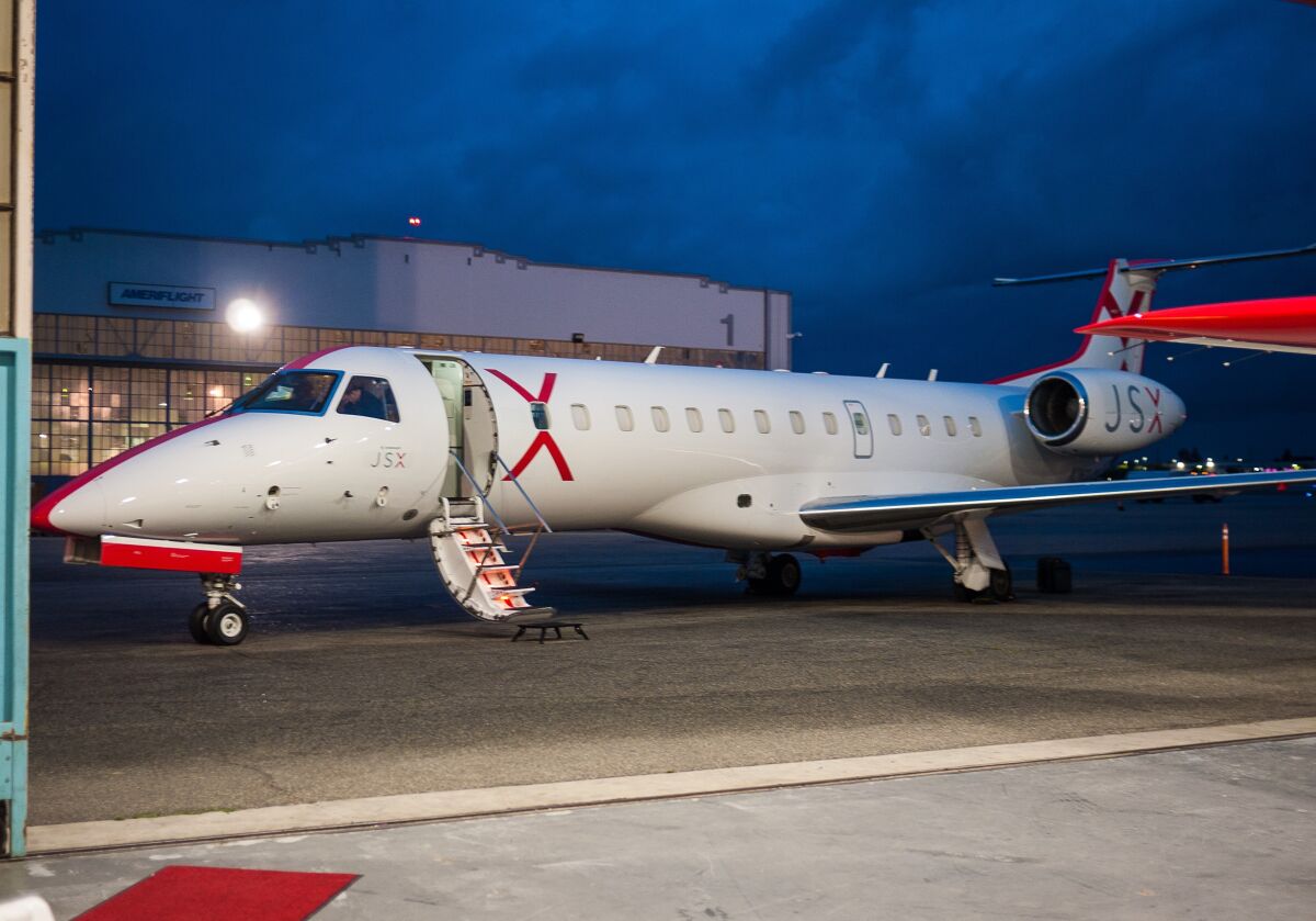 Passengers board JSX's 30-seat planes by a short stairway.