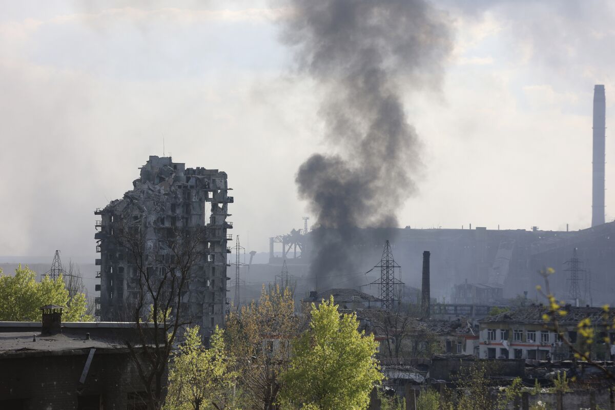 FILE - Smoke rises from the Azovstal steel mill in Mariupol, in territory under the government of the Donetsk People's Republic, eastern Ukraine, May 4, 2022. (AP Photo/Alexei Alexandrov, File)