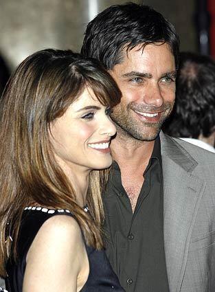Actor John Stamos and Amanda Peet from the new show "Studio 60 on the Sunset Strip" pose together on the red carpet as NBC introduces its new season line-up. Peet is in the cast of the new show.