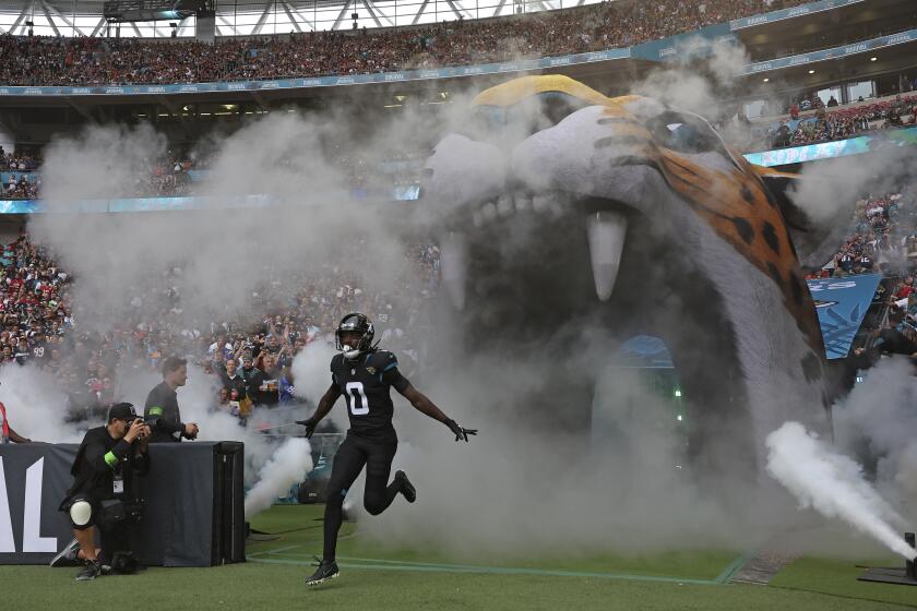 Jacksonville Jaguars wide receiver Calvin Ridley (0) runs onto the field for an NFL football game between the Atlanta Falcons and the Jacksonville Jaguars at Wembley stadium in London, Sunday, Oct. 1, 2023. (AP Photo/Ian Walton)
