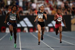 USA's Sydney McLaughlin-Levrone (C) runs to second place flanked by winner Dominican Republic's Marileidy Paulino (L) in the women's 400m event during the IAAF Diamond League "Meeting de Paris" athletics meeting at the Charlety Stadium in Paris on June 9, 2023. (Photo by Jeff PACHOUD / AFP) (Photo by JEFF PACHOUD/AFP via Getty Images)