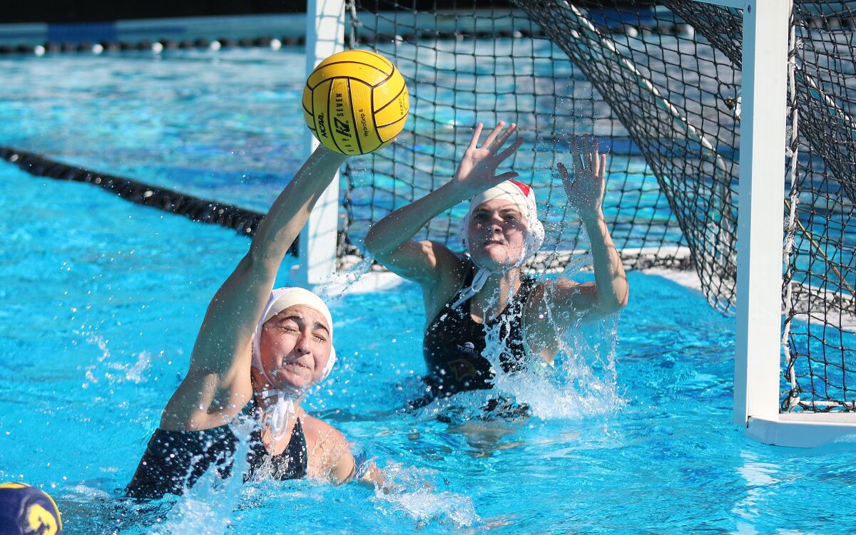 Junior Sophia Press and goalie Campbell Bush.