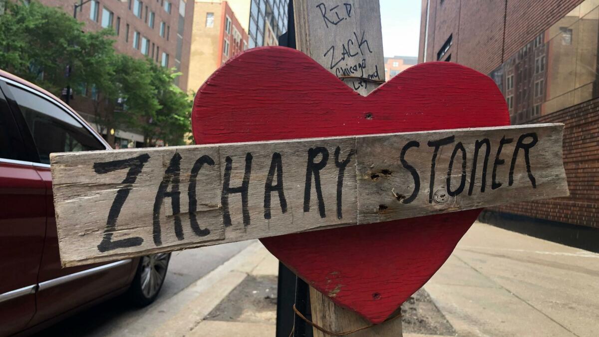 A makeshift cross marks the spot where Zachary Stoner was killed last year in a drive-by shooting in downtown Chicago.