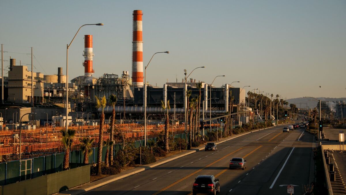 Los Angeles is abandoning a plan to spend billions of dollars rebuilding three gas-fired power plants along the coast to get the city closer to its goal of 100% renewable energy and improve air quality. Seen here is the Scattergood plant in El Segundo on Feb. 11.