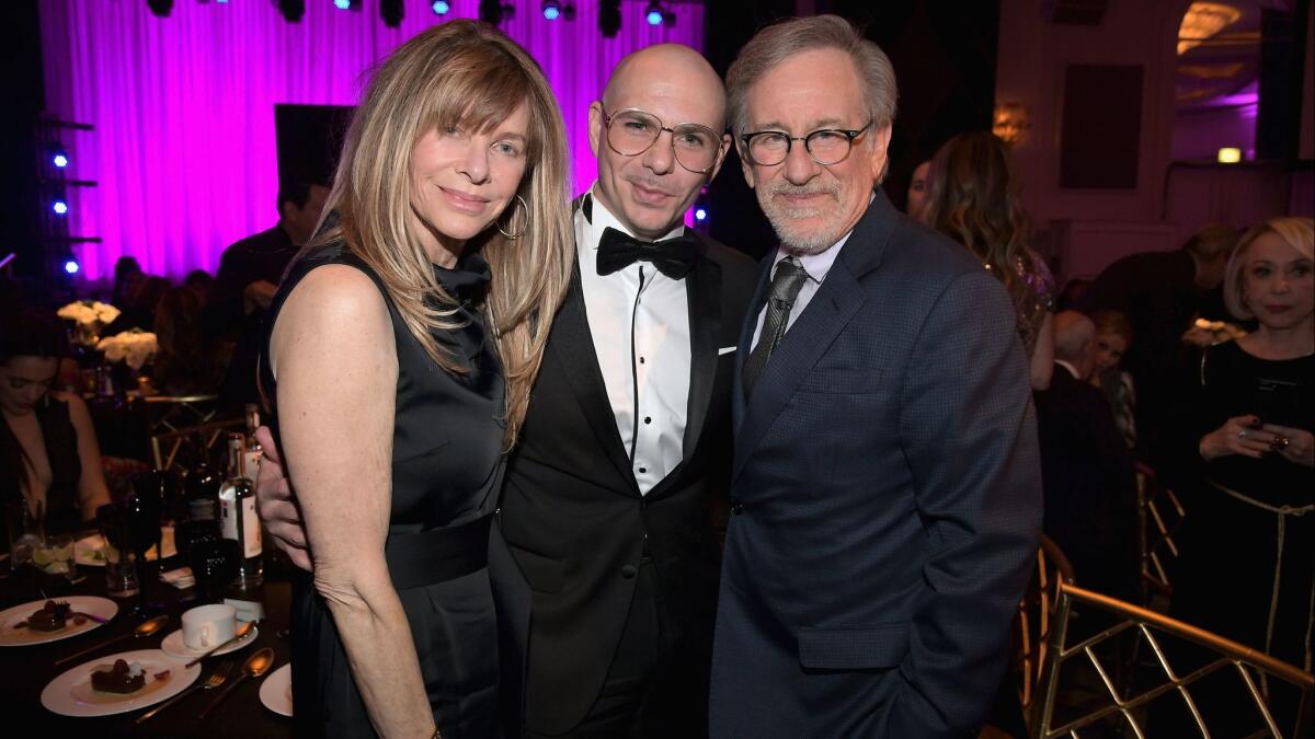 Kate Capshaw, left, Pitbull and Steven Spielberg attend WCRF's An Unforgettable Evening in Beverly Hills.