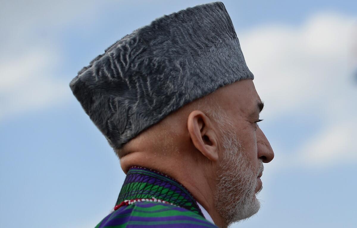 Afghan President Hamid Karzai, shown at a ceremony Sept. 10 at Wazir Akbar Khan hill in Kabul, has refused to sign a bilateral pact extending the presence of U.S. troops in his country beyond year's end in part over the issue of civilian casualties.