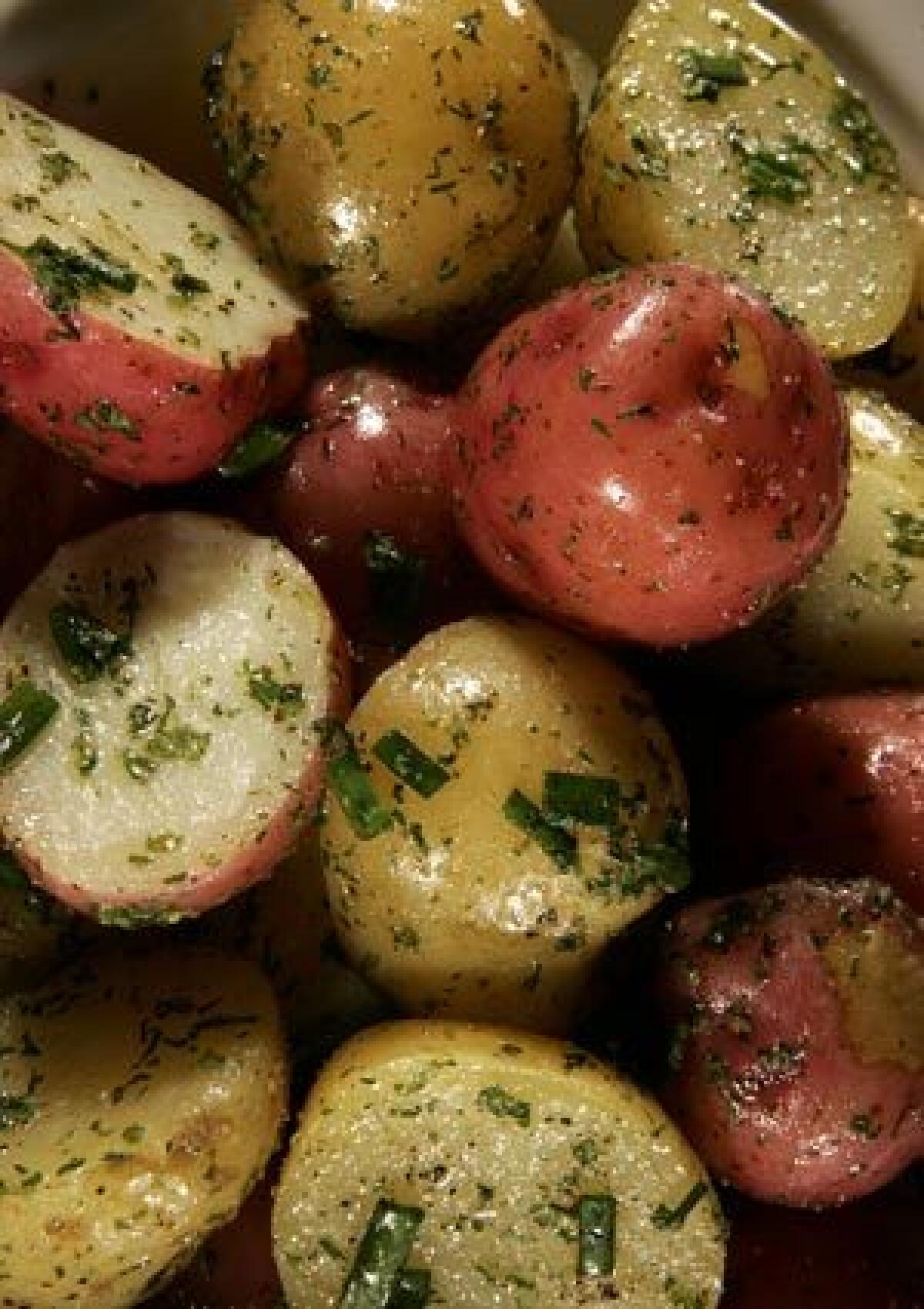 DELICATE: Fresh herbs add bright flavor to red and white potatoes. Click here for the recipe.