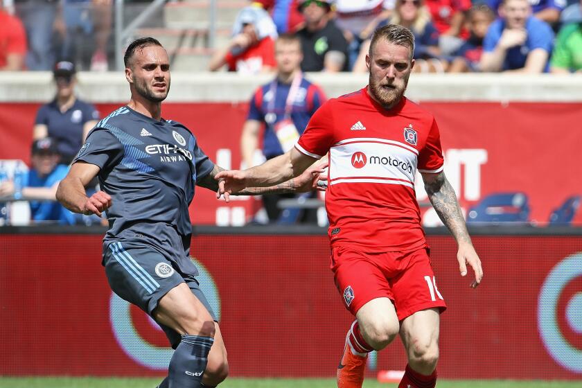 BRIDGEVIEW, ILLINOIS - MAY 25: Aleksandar Katai #10 of Chicago Fire advances agauinst Maxime Chanot #4 of New York City FC at SeatGeek Stadium on May 25, 2019 in Bridgeview, Illinois. The Fire and NYCFC tied 1-1. (Photo by Jonathan Daniel/Getty Images)