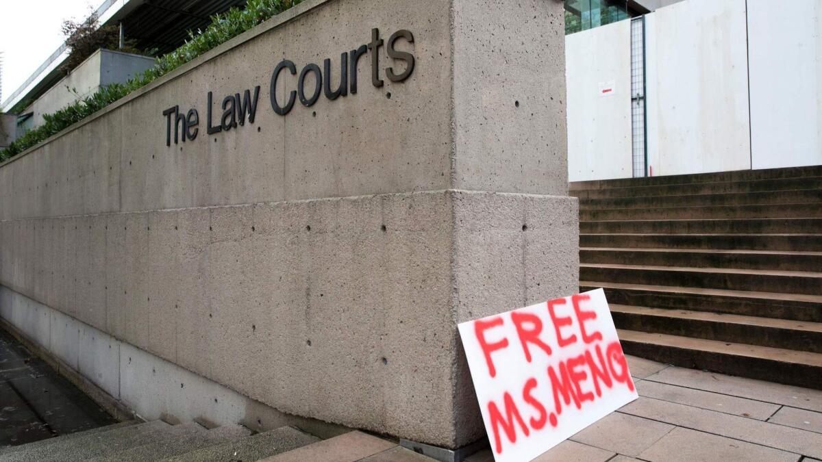 A sign calling for the release of Huawei Technologies Chief Financial Officer Meng Wanzhou is seen outside British Columbia Superior Courts following her Dec. 1 arrest in Canada for extradition to the U.S. in Vancouver, Canada, on Dec. 10.