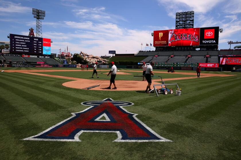 As the Angels prepare to negotiate a potential new lease with the city of Anaheim, the team makes it clear that the name will remain the Los Angeles Angels. A general view of the grounds crew preparing the field is seen prior to the MLB game between the Chicago White Sox and the Los Angeles Angels at Angel Stadium of Anaheim on August 18, 2019 in Anaheim, California. (Victor Decolongon/Getty Images) ** OUTS - ELSENT, FPG, TCN - OUTS **
